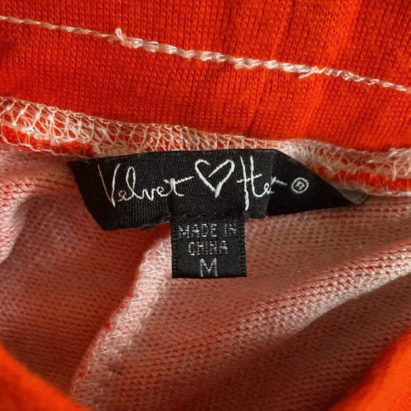 velvet heart size medium, orange, and color with white legs. Preowned. - Picture 2 of 2